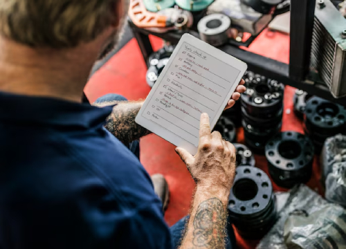 Mechanic Performing Log Book Service